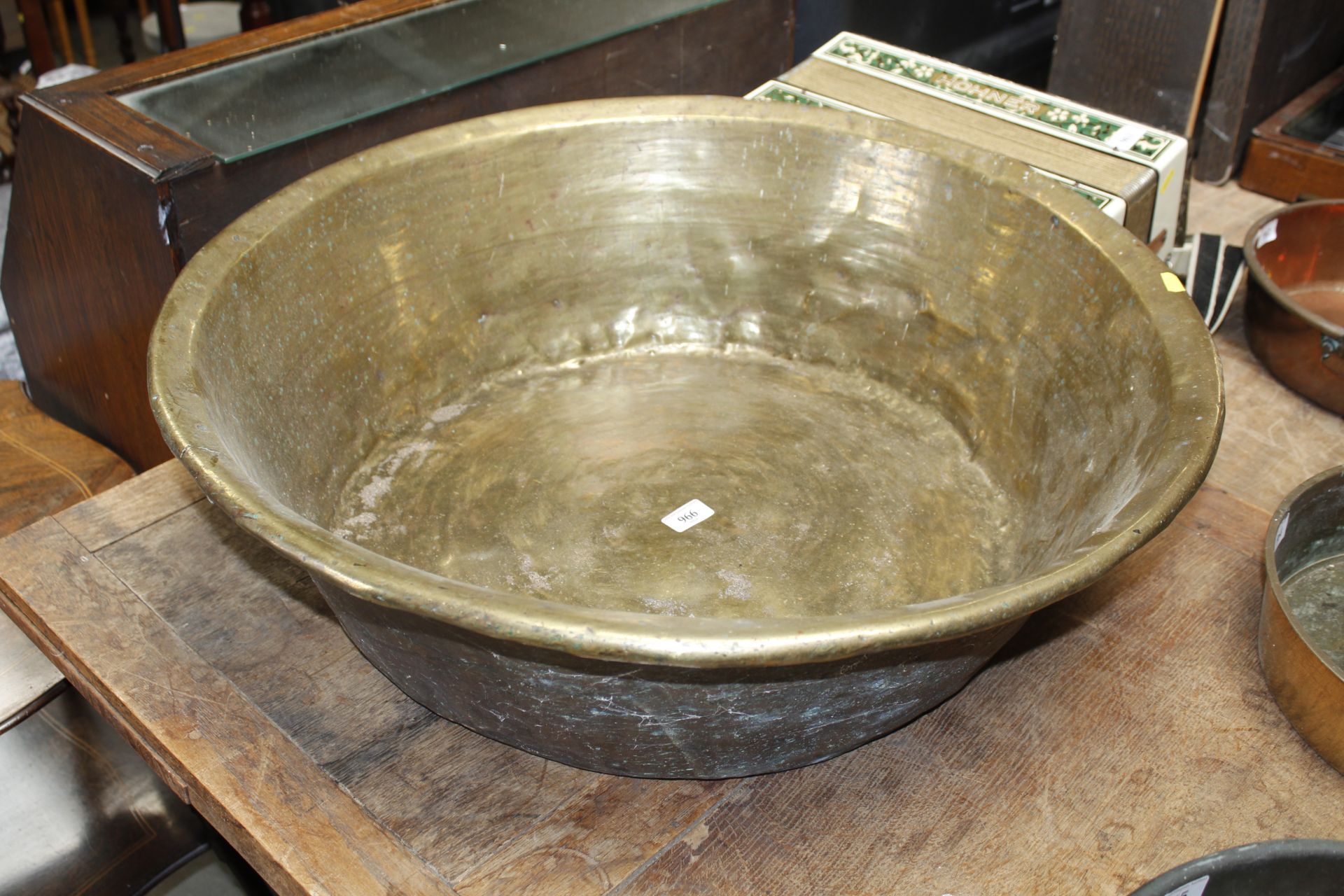 A large brass vat