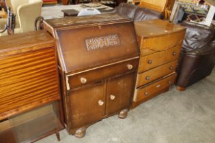 An oak chest fitted long drawers and a bureau fitted single drawer with a cupboard below