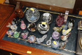 A quantity of various paperweights and glass bird