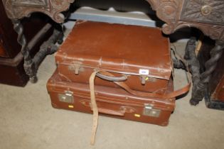 Two vintage cases, one containing various books