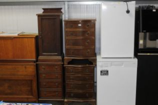 A pair of reproduction bow front chests, each fitt