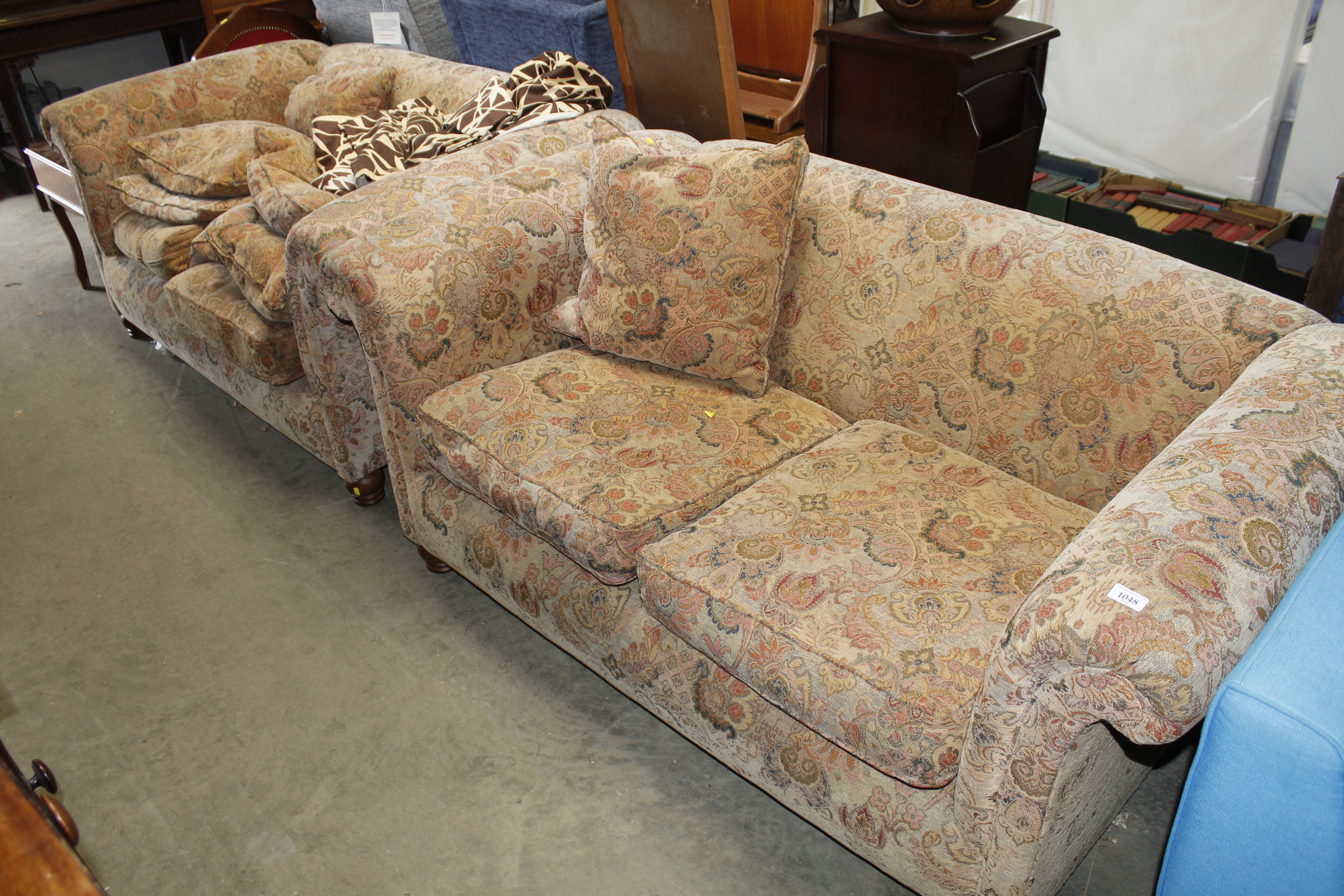 A pair of floral upholstered two seater settee