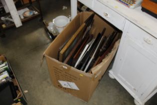 A box containing various pictures and prints