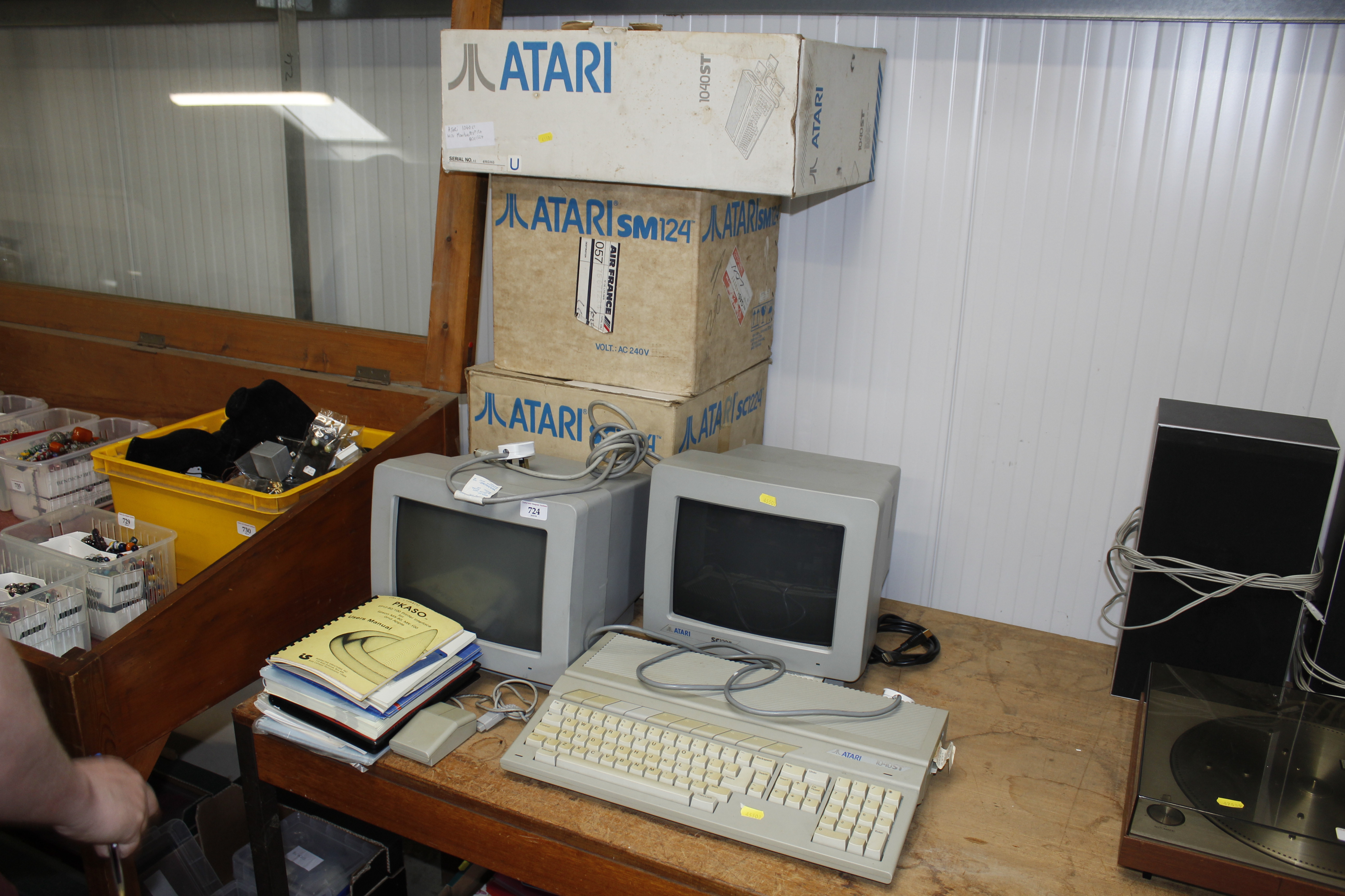 An Atari 1040STF computer with two monitors, boxes and manuals etc.