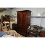 A Victorian mahogany linen press, base fitted two