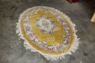 An approx. 6'9" x 5" floral pattered rug AF
