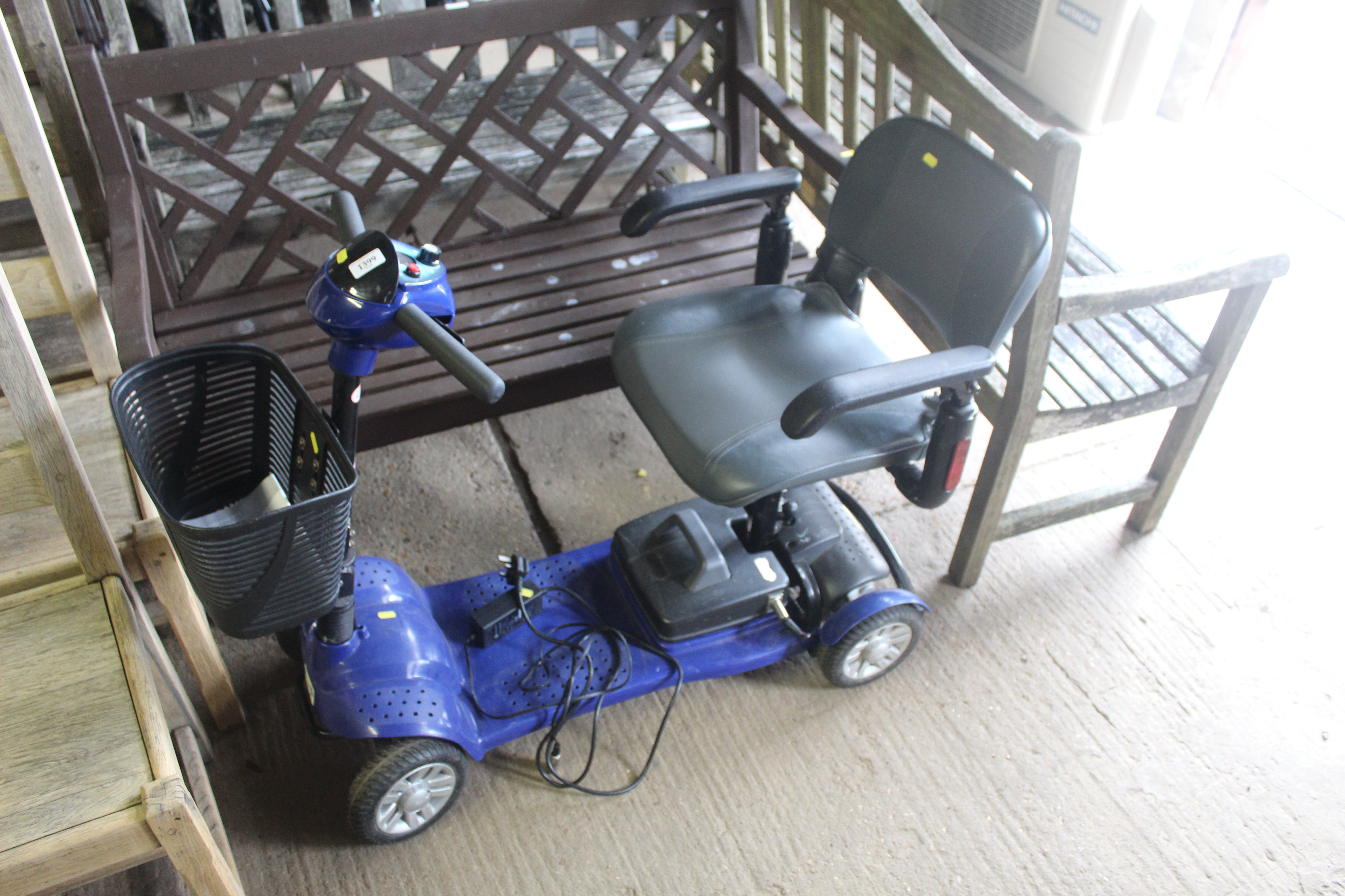 A Betterlife mobility scooter with charger and man