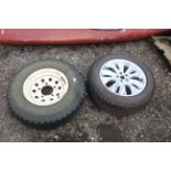 A Land Rover Defender wheel and tyre and a Land Ro
