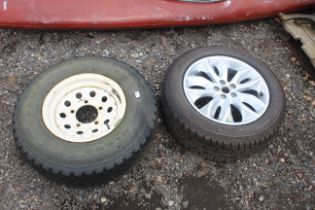 A Land Rover Defender wheel and tyre and a Land Ro