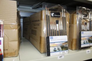 Two boxes containing sets of ten assorted paint brushes