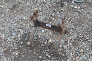 An ornate wrought iron boot scraper