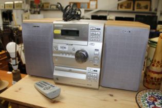 A Sony mini HiFi and matching speakers with remote