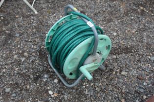 A Hozelock garden hose reel and length of hose