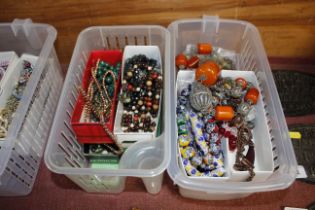 Two boxes of costume jewellery mainly bead necklac