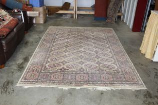 An approx. 9'1 x 6'4" pattern wool rug AF