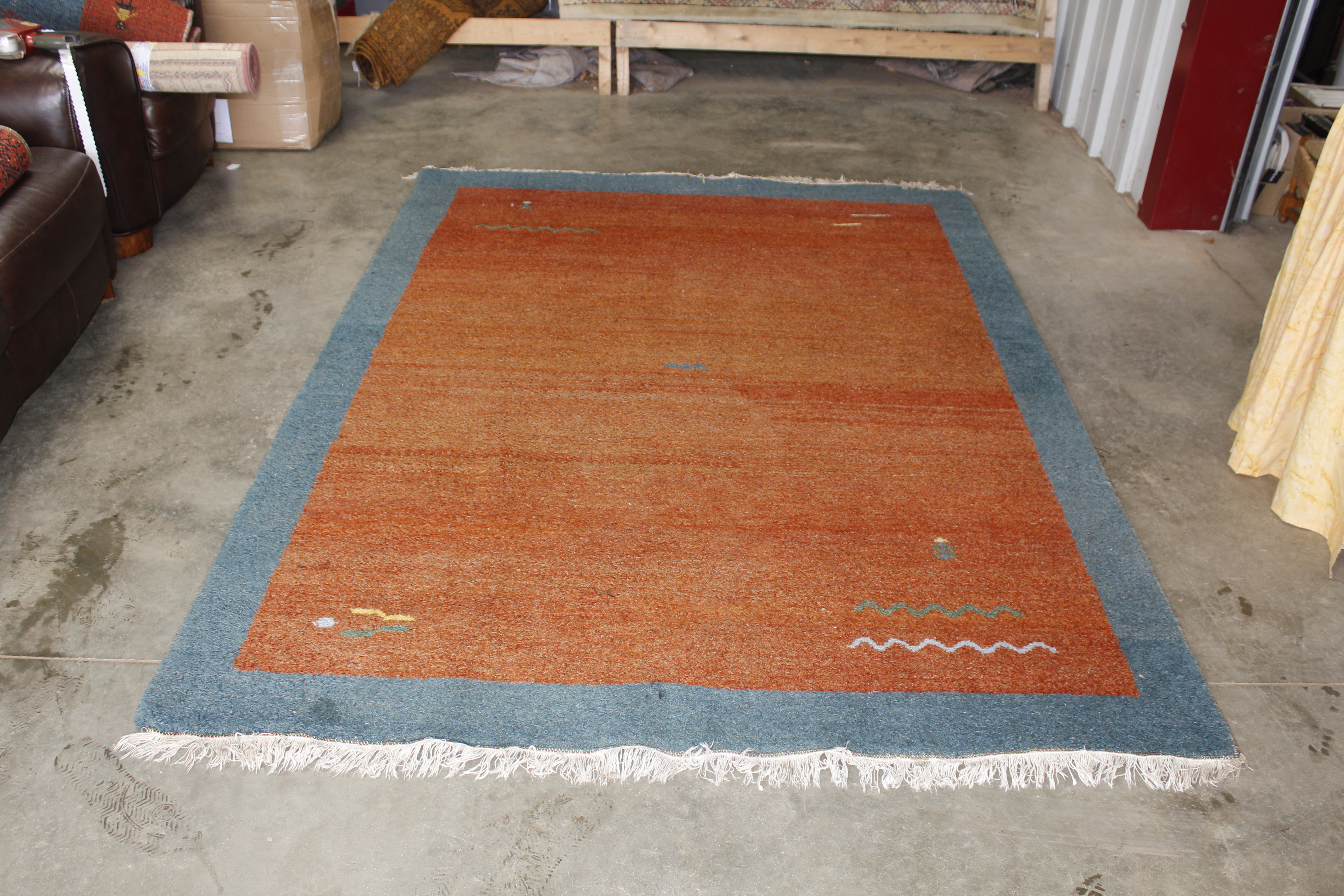 An approx. 8'6" x 5'10" patterned wool rug