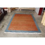 An approx. 8'6" x 5'10" patterned wool rug