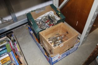 Three boxes containing various cutlery and kitchen