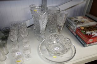 Four cut glass vases, a bowl and dish