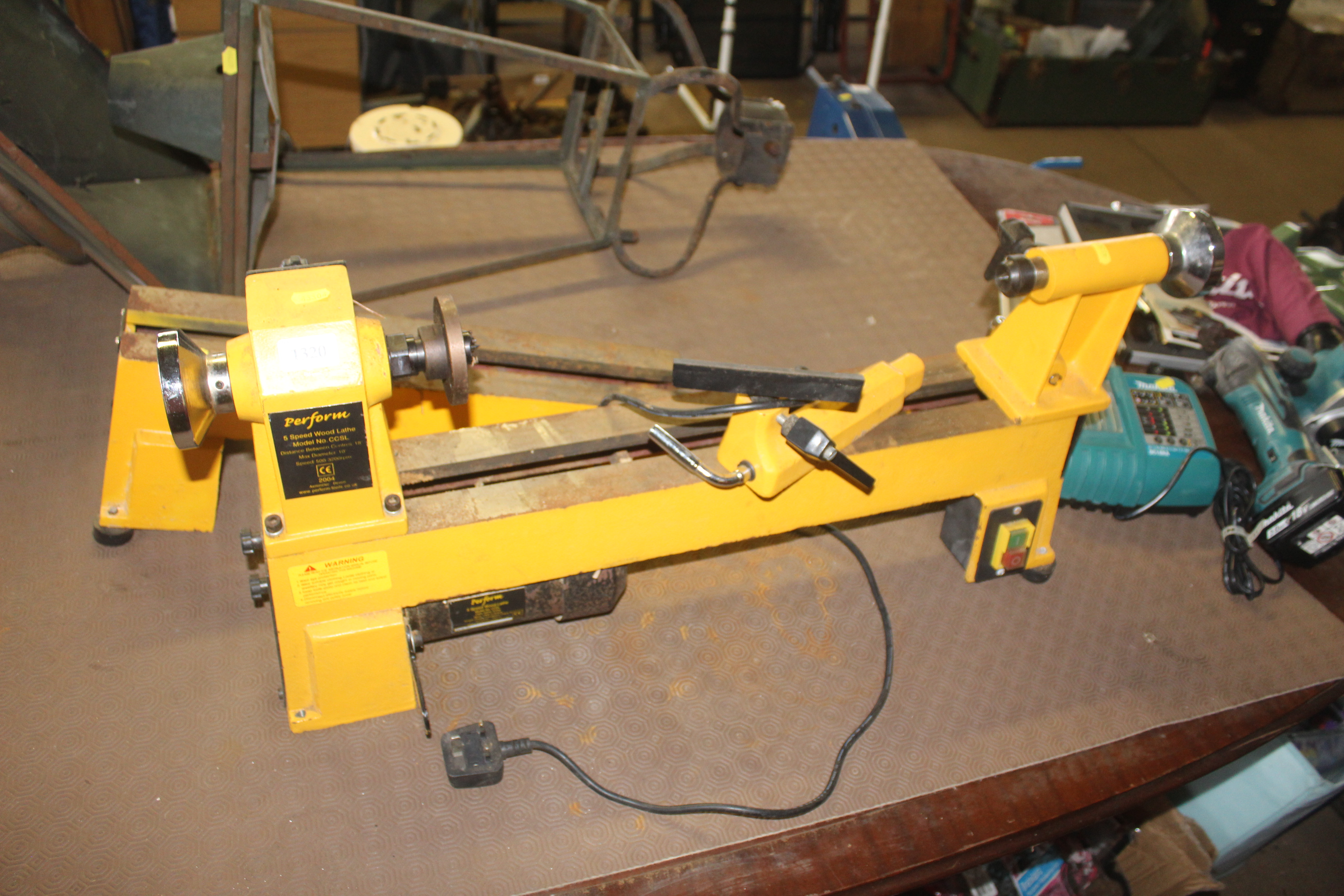 A Perform five speed wood lathe with lathe extensi