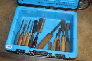 A box containing a quantity of wooden handled tool