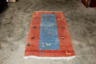 An approx. 5'10" x 3" patterned wool rug