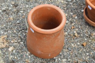 A terracotta chimney pot