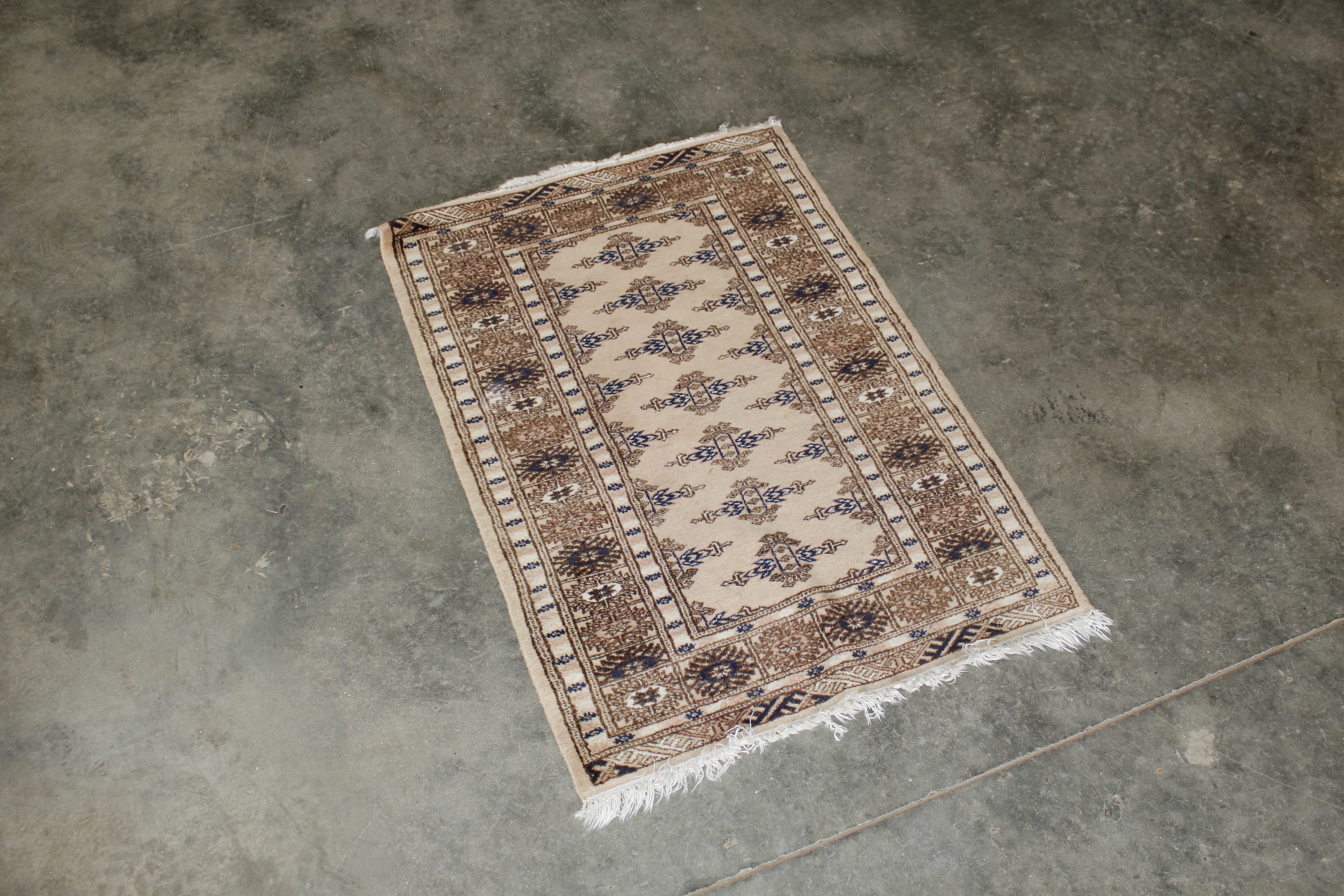 An approx. 3'3" x 2'2" Eastern patterned rug