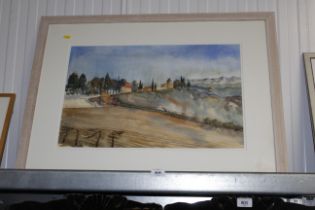 A framed watercolour study of a continental landsc