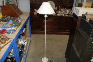 A floor standing lamp and shade