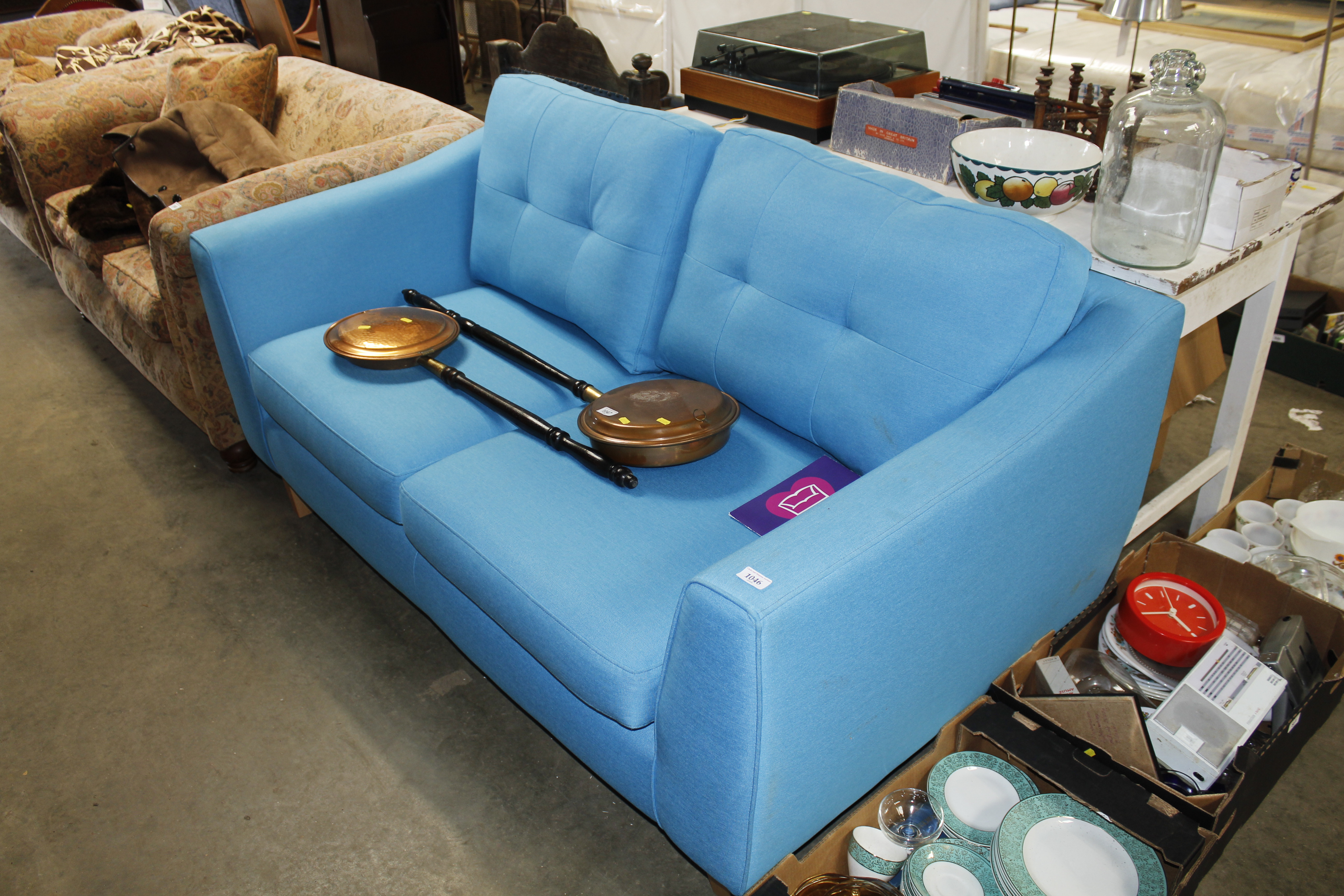 A DFS blue upholstered settee