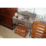 A late Victorian carved oak dressing table raised