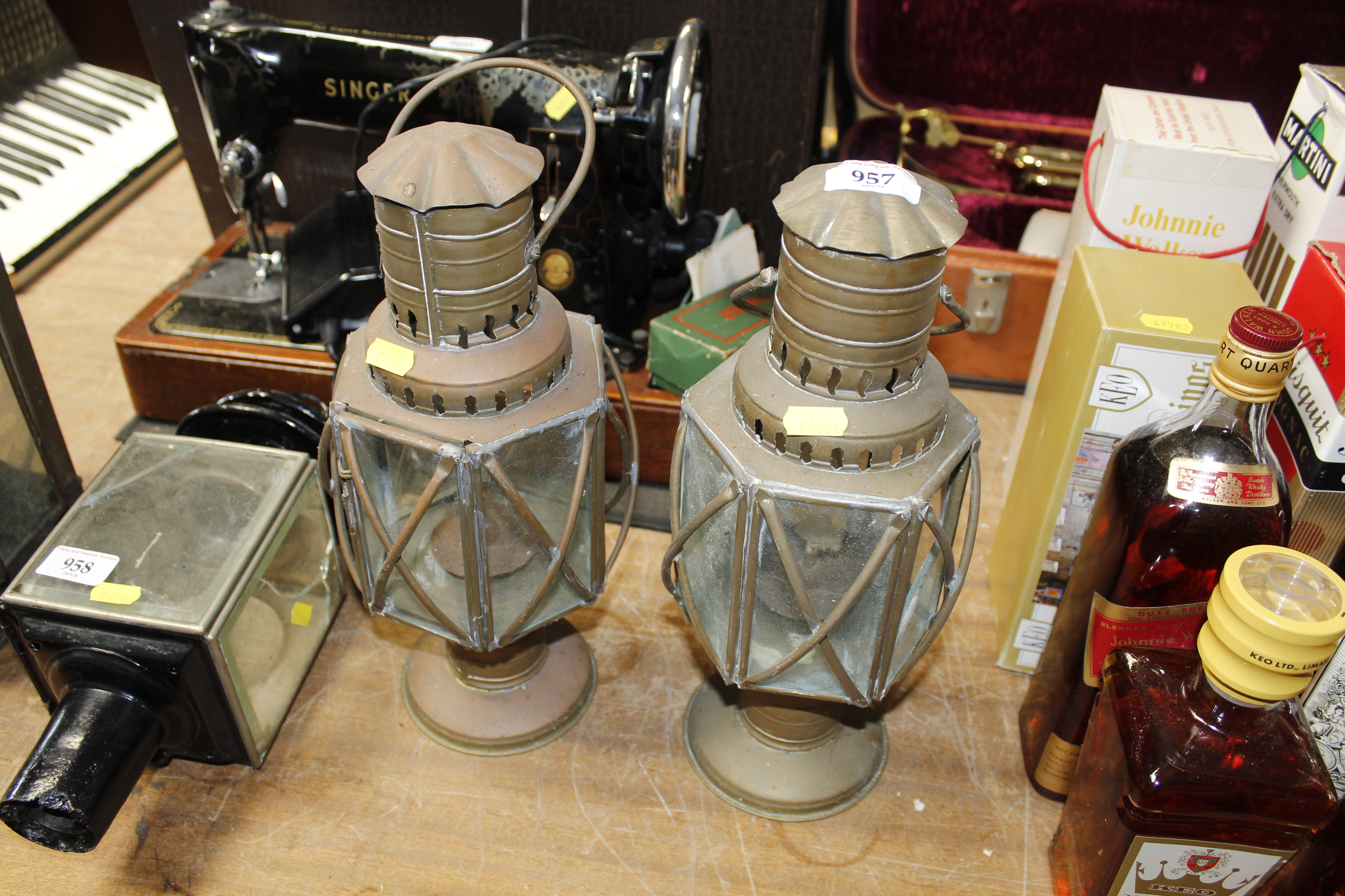A pair of copper and brass hanging oil lanterns