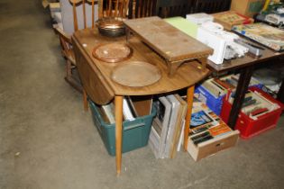 A Formica drop leaf kitchen table