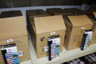 Two boxes containing sets of ten acrylic paints