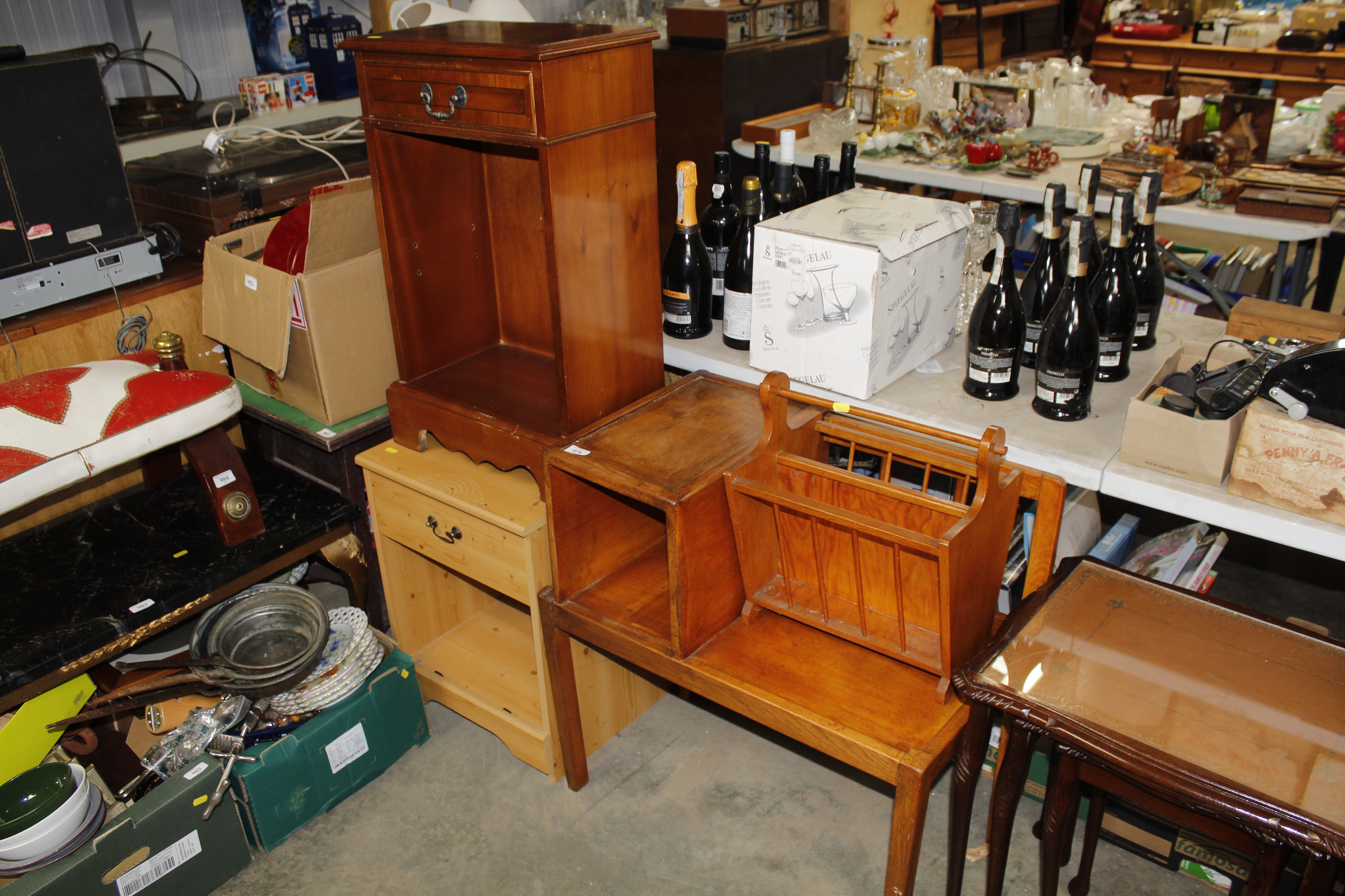 A telephone table, a magazine rack, a pine effect