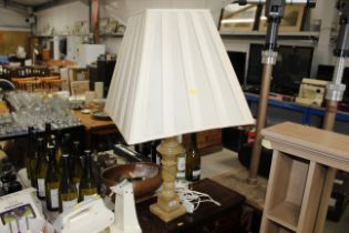 An alabaster table lamp and shade