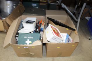 Two boxes containing books and DVDs, First Aid box