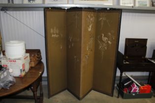 A needlework decorated four fold screen
