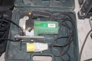 A Hitachi CJ65V2 110v jigsaw in fitted in plastic