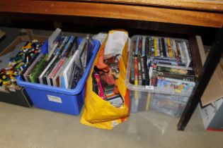 Two boxes and a bag of various DVDs