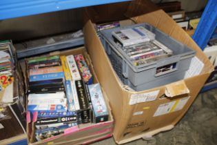 Three boxes containing DVDs
