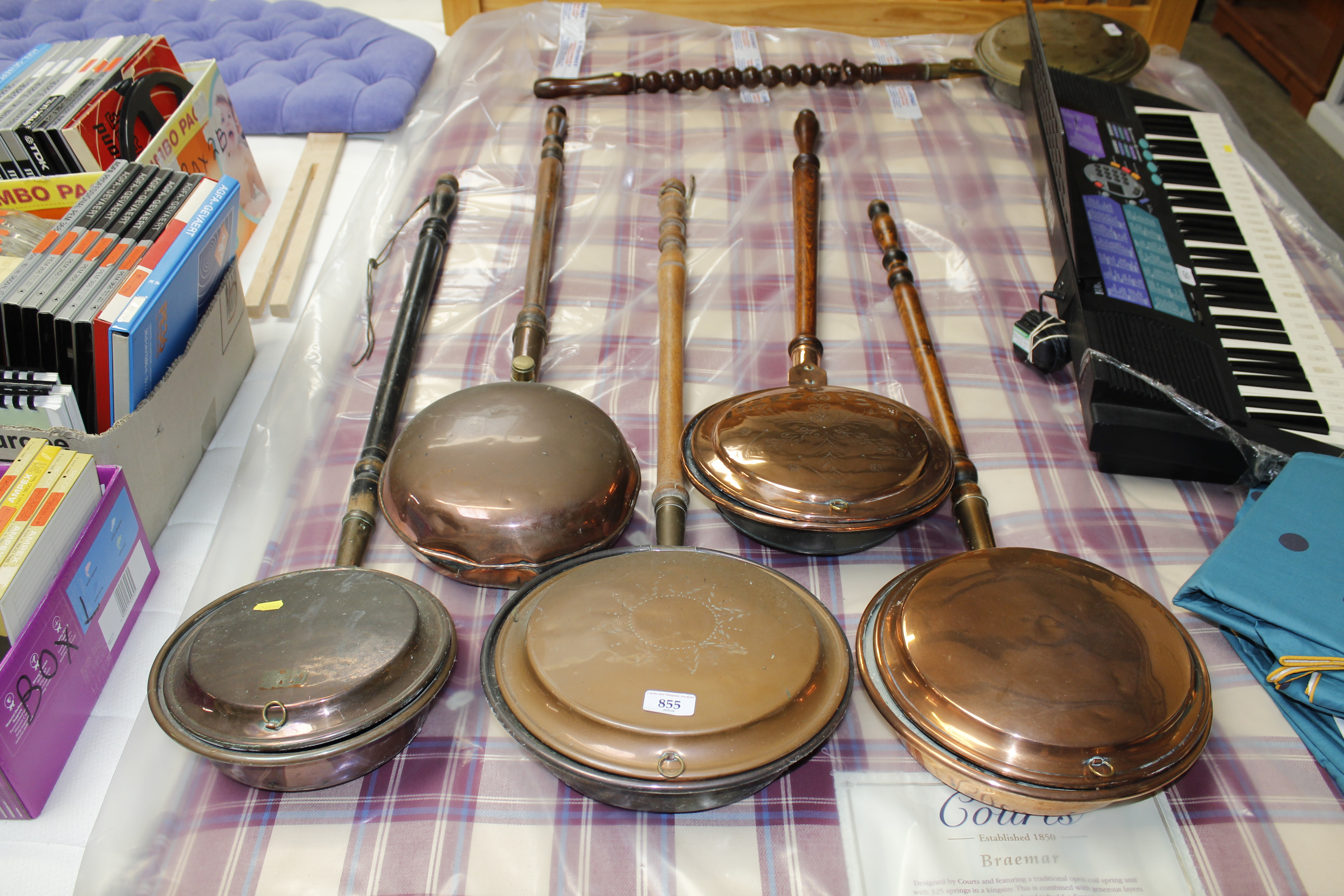 Five copper warming pans with turned wooden handle