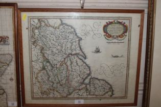 A framed and glazed hand coloured map of Lincoln,
