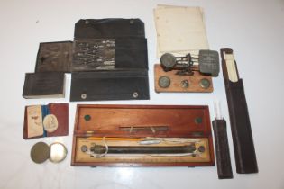 A set of wooden and brass postage scales and weigh
