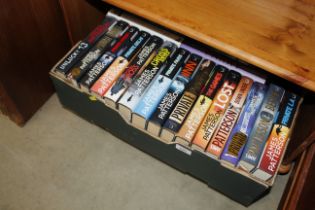 A box of James Patterson novels