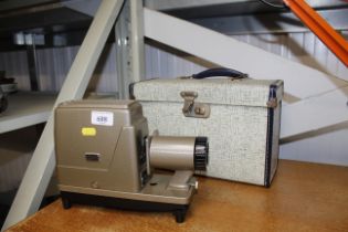 An Argos 300 Compact slide projector with original