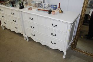 A white painted three drawer serpentine fronted ch