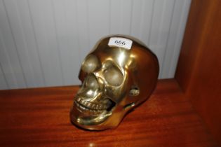 A brass skull ornament (76)