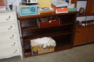 A mahogany open fronted bookcase with adjustable s